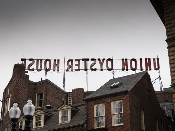 Union Oyster House sign from behind on cloudy day